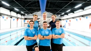 Team of 6 swim instructors in front of a pool